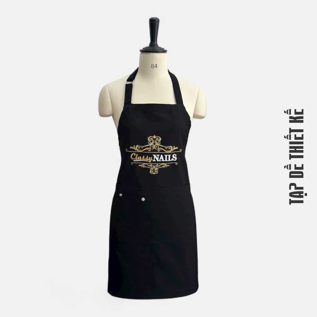 Tạp dề nail màu đen, mẫu phổ biến nhất tại salon nail hiện đại.