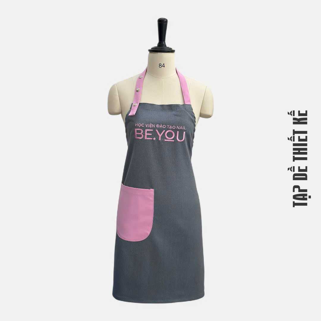 Mẫu tạp dề pastel hồng – kem, nhẹ nhàng, phù hợp tiệm nail nữ tính
